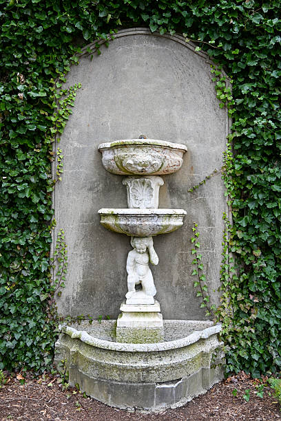 istock Water Fountain Surrounded by Ivy 2248436176