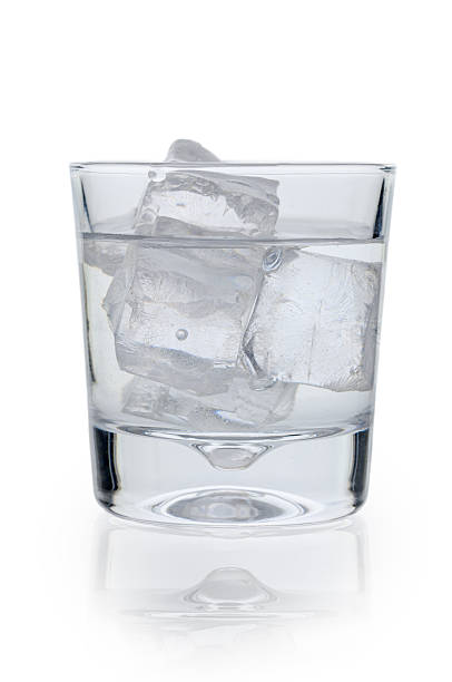 istock Refreshing Glass of Water with Ice on White Background 2248436582