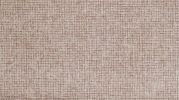 Jute fabric texture background. Close-up of brown woven canvas texture with clear thread pattern. Natural background with rustic and craft textile appearance