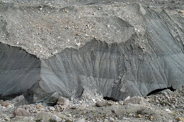 Glacier interior with ice formations, blue and white textures, crevasses and natural light showing frozen landscape, cold environment, alpine scenery, trekking route and high altitude ice structure