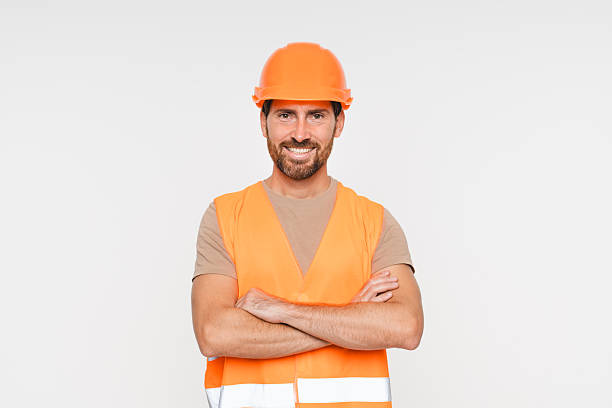 istock Happy male contractor, mockup and professional builder with helmet. Construction worker in portrait, man with crossed arms and smile, architect or engineer in building industry on studio background. 2248439415