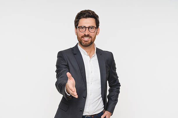 istock Portrait, smile and business man with handshake in studio for agreement, interview or welcome on white background. Professional, corporate Caucasian person for greeting, thank you or job opportunity 2248440427
