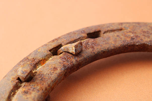 istock Rusty nails, horseshoe symbolizing luck and good fortune 2248440988