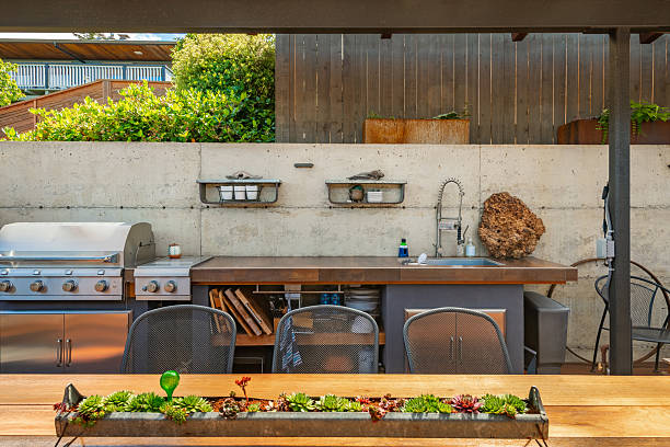 istock Stunning outdoor living area with kitchen dining table and chairs seating area fireplace hammock covered patio and pass through to home interior 2248444873