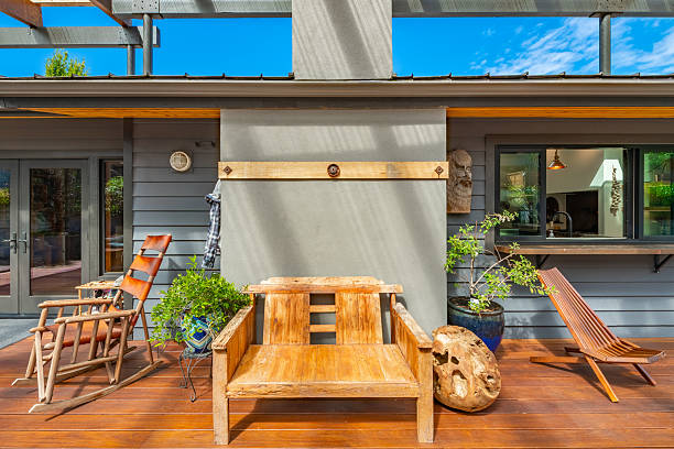istock Stunning outdoor living area with kitchen dining table and chairs seating area fireplace hammock covered patio and pass through to home interior 2248444876
