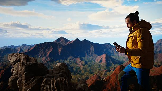istock Reckless trekker risking his life focusing on his phone and falling 2248445615