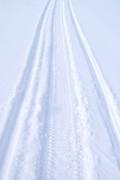 istock Snowmobile track trail on the snow 2248446221