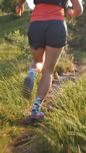 istock Runner in Motion on Grassy Trail, Cross-country Running 2248447307