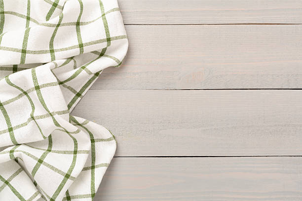 istock Kitchen napkin on wooden background, top view 2248449199