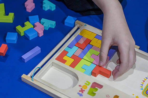 istock colorful wooden Tetris-style puzzle pieces 2248454708