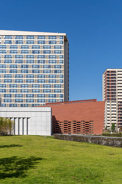 istock Modern urban architecture in front of green spaces 2248455172
