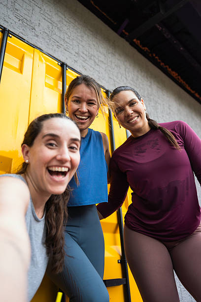 istock Three latin hispanic women smiling, feeling joyful and fit after exercising. Enjoying friendship and a healthy lifestyle 2248456685