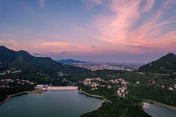 A reservoir and mountains in the sunset glow