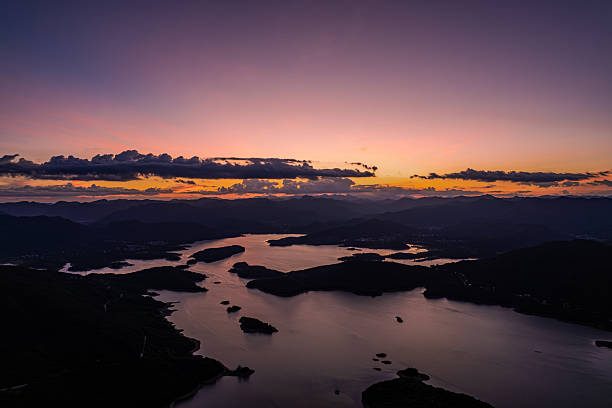 A reservoir and mountains in the sunset glow