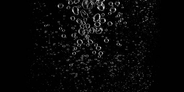 istock Clear water bubbles rising in dark background, abstract underwater texture ideal for design, science, and creative projects. Perfect for backgrounds, overlay, or refreshing clean concept visuals. 2248457990