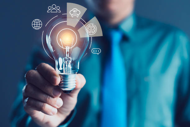 istock Businessman Holding Glowing Light Bulb with AI Brain Icons, Technology Innovation, Digital Idea, and Smart Solution 2248463068