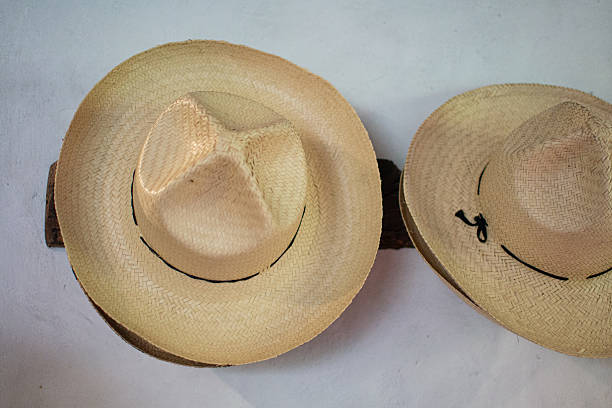istock Straw hats hanging on white wall at hacienda 2248466022