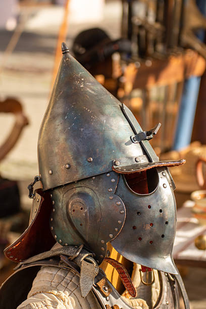 old medieval bascinet-type helmet popular in medieval Europe, evolving from a simple steel cap in the late 13th century