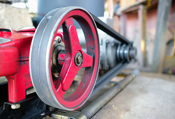 A close view of a water pump showing its metal parts and mechanism.