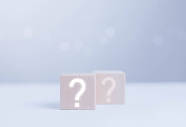 istock Minimal wooden blocks with glowing question marks symbolize uncertainty, decision-making, problem solving, and inquiry, ideal for concepts related to FAQs, choices, analysis, and strategic planning. 2248474726