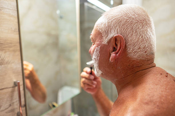 istock Elderly man is shaving with care 2248476755
