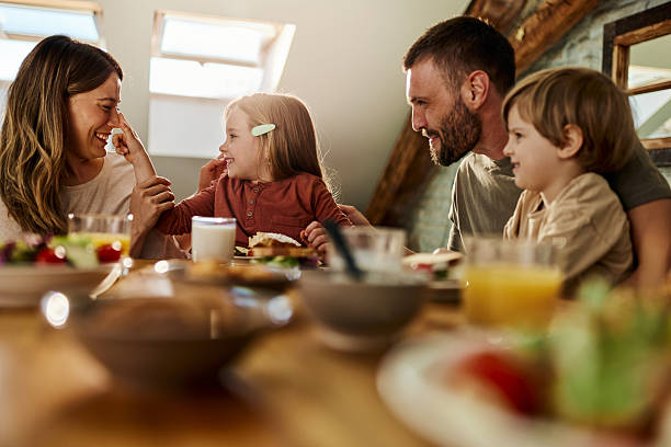 istock Cheerful family having fun during breakfast at dining table. 2248477163