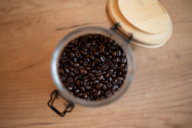 istock Coffee beans in a glass jar 2248477576