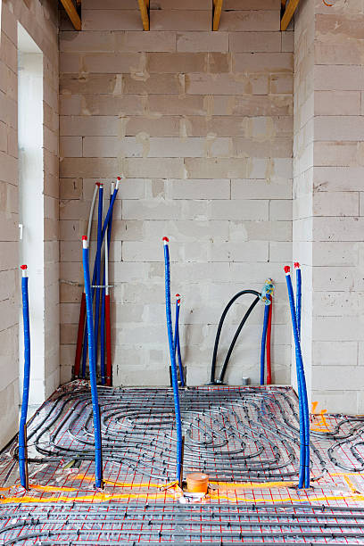 istock Plumbing and underfloor heating installation in new house interior 2248478254