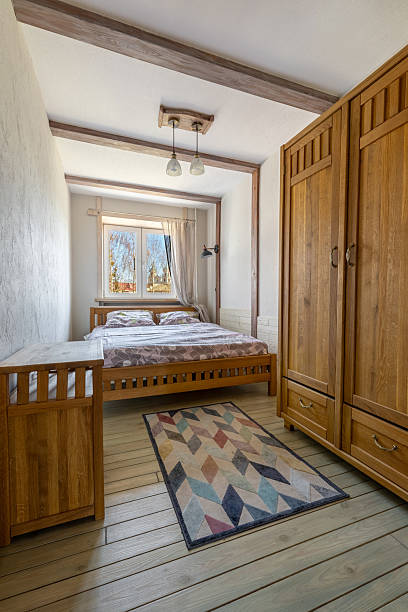 istock Bright Wooden Bedroom Interior with Cozy Double Bed 2248480448