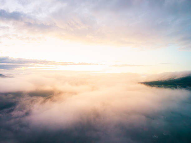 istock Aerial View of Sunset Above Clouds and Rolling Fog Layers 2248482411