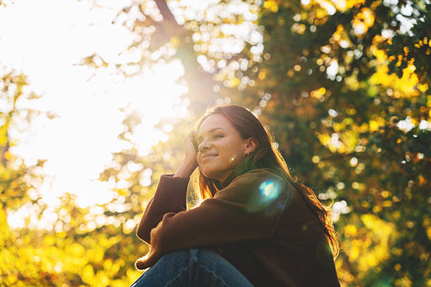 istock Modern woman enjoying simple mindful life outdoors in fall park 2248485488