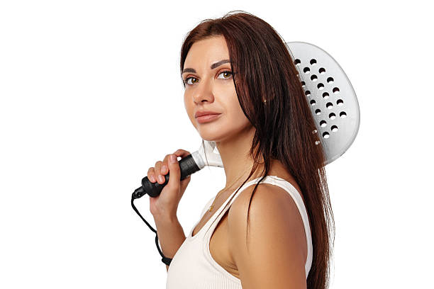 istock Woman holding a cooking spatula while staring confidently at the camera in a bright setting 2248486144