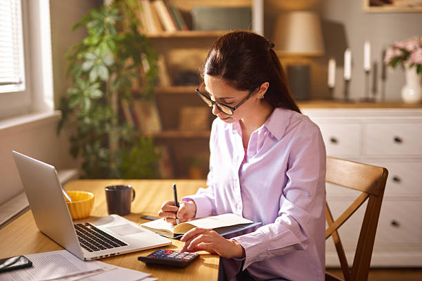 istock Focused accountant managing finances remotely from home office 2248488647
