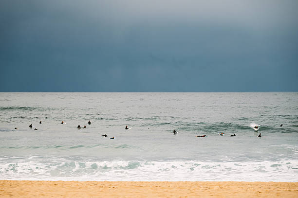 istock Surfers in the sea 2248490590