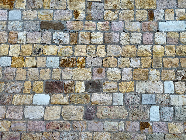 A Weathered Mosaic of Natural Stones Forming an Old Rustic Wall