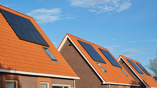 istock A row of new houses with solar panels 2248492576