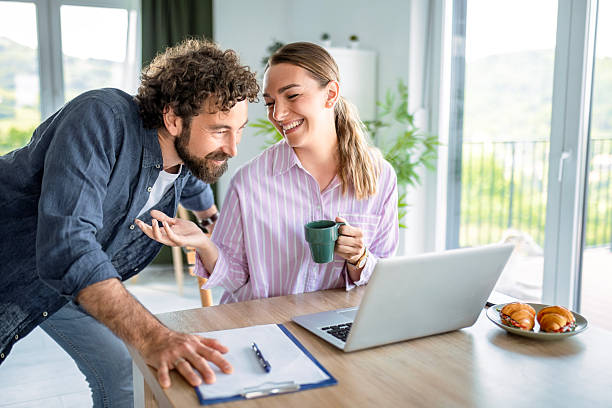 istock Couple Enjoying Productive Work Session with Laptop 2248495178