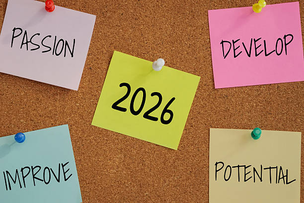 istock 5 post-it paper pin on board with number 2026 in the middle and word passion, develop, improve, potential around. new year goal target for work with passion concept 2248496254