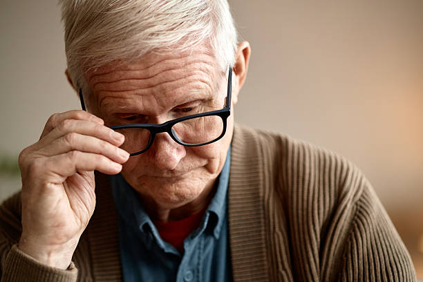 istock Senior Man Wearing Glasses Indoors Thoughtfully 2248497059
