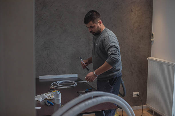 istock Electrician preparing cable for air conditioning installation 2248498880