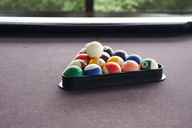 Billiard Balls Arranged for Break on Purple Table