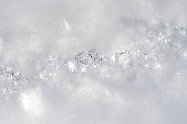 istock Beautiful white snowflakes falling down from the blue cloudy sky on a bright day 2248503314