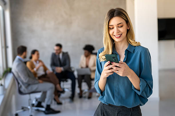 istock Busy smiling executive business team using digital devices in office. Diverse professional people 2248506209