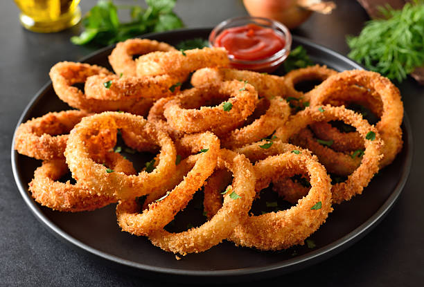 istock Onion rings with tomato sauce 2248507153