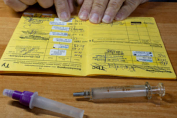istock Doctor records the current vaccinations in the vaccination booklet 2248512721