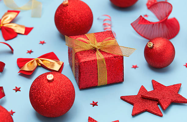 istock Red Christmas ornaments on blue background 2248529367