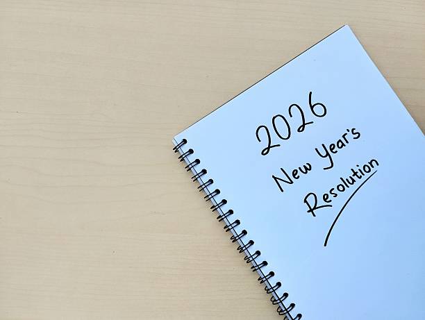 istock 2026 New year concept written on note book with wooden table background 2248534219