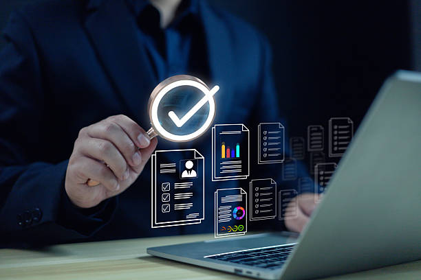 istock A person reviewing digital documents and data charts with a highlighted checkmark symbol represents workflow approval, data verification, business analysis, and efficient digital document management. 2248534987