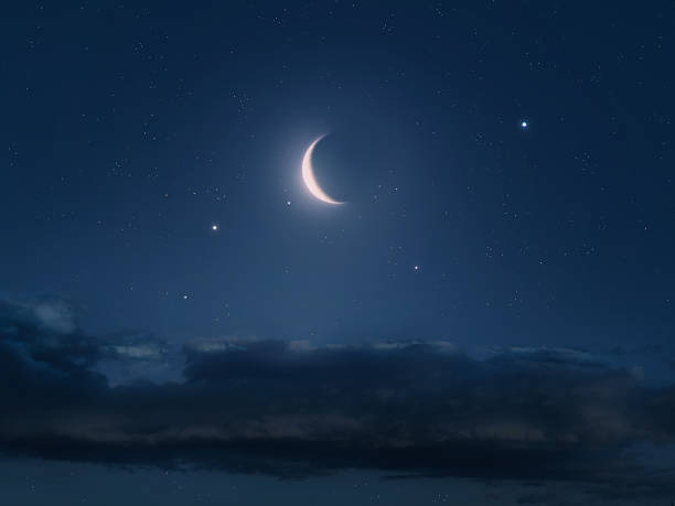 istock Crescent moon with constellation in the night sky above the clouds. 2248535676