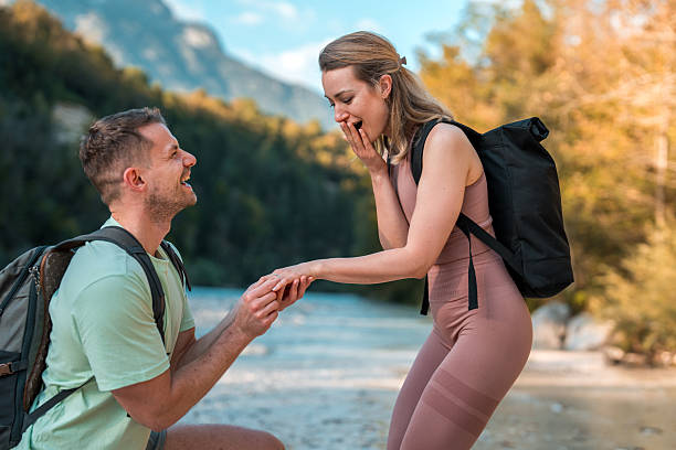 istock Caucasian Male's Romantic Ring Moment by the River 2248535775